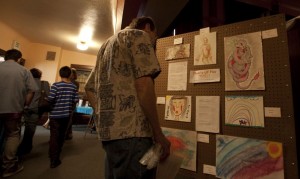 Visitor admiring the art work.